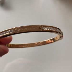 Michael Kors bracelet. 6.5” interior circumference. Gold-tone with